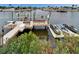 Private dock with boat lifts and seating area at 861 Symphony Isles Blvd, Apollo Beach, FL 33572