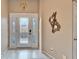 Bright and airy entryway with tiled floors and elegant decor at 861 Symphony Isles Blvd, Apollo Beach, FL 33572