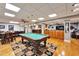 Open concept game room with pool table, wet bar, and lounge area at 861 Symphony Isles Blvd, Apollo Beach, FL 33572
