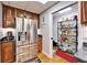 Kitchen with stainless steel refrigerator and walk-in pantry at 861 Symphony Isles Blvd, Apollo Beach, FL 33572
