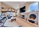 Spacious living room with a fireplace and built-in shelving at 861 Symphony Isles Blvd, Apollo Beach, FL 33572