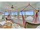 Sunroom with water views and comfortable hammock at 861 Symphony Isles Blvd, Apollo Beach, FL 33572