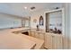 Wet bar with cabinetry and shelving for storage at 861 Symphony Isles Blvd, Apollo Beach, FL 33572