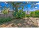 Large backyard with mature trees and a wooden fence at 930 15Th N Ave, St Petersburg, FL 33704