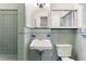Bathroom with light blue tile and updated vanity at 930 15Th N Ave, St Petersburg, FL 33704