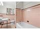 Bathroom with pink tile and vintage fixtures at 930 15Th N Ave, St Petersburg, FL 33704