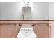 Pink tile bathroom with a vintage sink and mirror at 930 15Th N Ave, St Petersburg, FL 33704