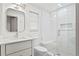 Clean bathroom with subway tile shower, built-in seat and updated vanity at 930 15Th N Ave, St Petersburg, FL 33704