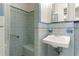 Clean bathroom with light blue tile and a walk-in shower at 930 15Th N Ave, St Petersburg, FL 33704