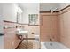Retro bathroom with pink tile and classic fixtures at 930 15Th N Ave, St Petersburg, FL 33704