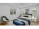 Comfortable bedroom with hardwood floors and large windows at 930 15Th N Ave, St Petersburg, FL 33704