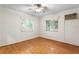 Spacious bedroom with hardwood floors and two windows at 930 15Th N Ave, St Petersburg, FL 33704