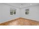 Bright bedroom with hardwood floors and two large windows at 930 15Th N Ave, St Petersburg, FL 33704