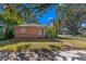 Brick home with mature trees and front yard at 930 15Th N Ave, St Petersburg, FL 33704