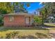 Brick home with landscaped yard and walkway at 930 15Th N Ave, St Petersburg, FL 33704