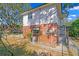 Rear view of home with brick and exterior stairs at 930 15Th N Ave, St Petersburg, FL 33704