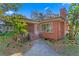 Brick home with mature trees and walkway at 930 15Th N Ave, St Petersburg, FL 33704