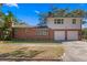 Brick home with two-car garage and well-maintained landscaping at 930 15Th N Ave, St Petersburg, FL 33704