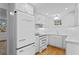 Updated kitchen features white cabinets,retro appliances, and quartz countertops at 930 15Th N Ave, St Petersburg, FL 33704