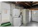 Basement laundry with stackable washer/dryer and extra storage at 930 15Th N Ave, St Petersburg, FL 33704