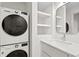 Stackable LG washer and dryer, modern vanity with a floating sink at 930 15Th N Ave, St Petersburg, FL 33704