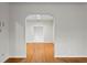 Living room with hardwood floors and arched entryway at 930 15Th N Ave, St Petersburg, FL 33704