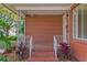 Brick porch with ornate railing and landscaping at 930 15Th N Ave, St Petersburg, FL 33704
