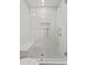 Spa-like shower with subway tile, glass enclosure, and penny round floor at 930 15Th N Ave, St Petersburg, FL 33704