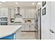 Bright kitchen features white cabinetry, stainless steel appliances, and a modern backsplash at 949 Signet Dr, Apollo Beach, FL 33572