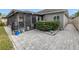 Screened patio with paver stones and landscaping at 10405 White Peacock Pl, Riverview, FL 33578