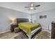 Spacious bedroom with wood-style flooring and a king-size bed at 10405 White Peacock Pl, Riverview, FL 33578