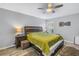 Bright bedroom with wood flooring and large bed at 10405 White Peacock Pl, Riverview, FL 33578