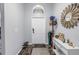 Bright and airy entryway with wood-look floors and decorative accents at 10405 White Peacock Pl, Riverview, FL 33578