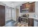 Well-equipped kitchen with ample cabinet space and stainless steel appliances at 10405 White Peacock Pl, Riverview, FL 33578