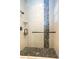 Bathroom with a glass-enclosed shower and pebble stone shower floor at 105 Wimbledon Ct, Redington Shores, FL 33708