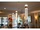 Modern lighting fixture in a dining room with a view into other rooms at 105 Wimbledon Ct, Redington Shores, FL 33708