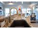 Stylish kitchen with a modern sink and gold faucet, granite countertops at 105 Wimbledon Ct, Redington Shores, FL 33708