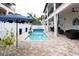 Enjoy this refreshing pool and spa with patio furniture at 105 Wimbledon Ct, Redington Shores, FL 33708