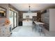 Modern wet bar with white cabinetry and quartz countertop at 105 Wimbledon Ct, Redington Shores, FL 33708