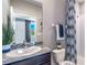 Modern bathroom with granite vanity and shower at 10585 Bridgegate Heights Loop, San Antonio, FL 33576