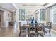 Bright dining room with farmhouse table and chairs at 10585 Bridgegate Heights Loop, San Antonio, FL 33576