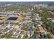 Aerial view of a residential area featuring houses, ponds, and lush greenery at 11140 Irish Moss Ave, Riverview, FL 33569