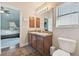 Bathroom with double vanity and shower at 11140 Irish Moss Ave, Riverview, FL 33569