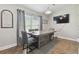 Bright dining room with a large wooden table and gray chairs at 11140 Irish Moss Ave, Riverview, FL 33569