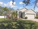 Landscaped yard and two-car garage at 11140 Irish Moss Ave, Riverview, FL 33569