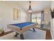 Game room featuring a pool table and a modern chandelier at 11140 Irish Moss Ave, Riverview, FL 33569