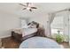 Bright main bedroom with large bed and hardwood floors at 11140 Irish Moss Ave, Riverview, FL 33569