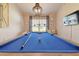 Blue pool table in a well-lit game room at 11140 Irish Moss Ave, Riverview, FL 33569