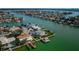 Bird's-eye view of waterfront home and canal at 11650 4Th E St, Treasure Island, FL 33706