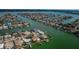 Bird's-eye view of canal-front homes and waterways at 11650 4Th E St, Treasure Island, FL 33706